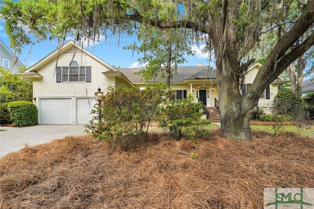 view of front of property with an attached garage and concrete driveway