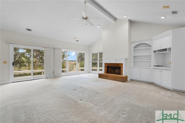 unfurnished living room with light carpet, visible vents, high vaulted ceiling, ceiling fan, and a fireplace