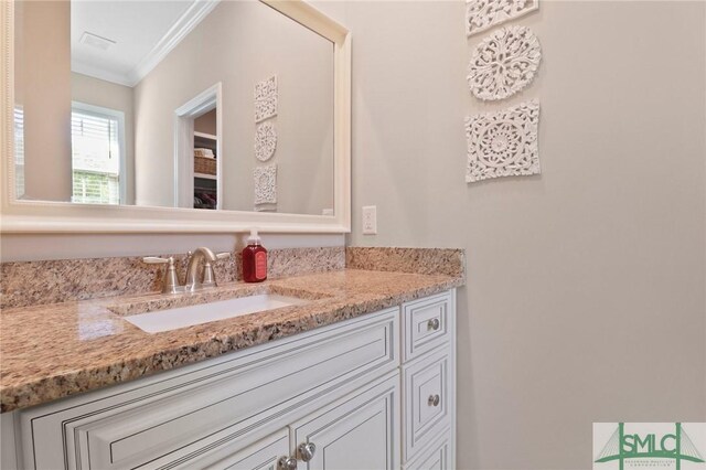 620 W 9th St, Rincon, GA 31326 - bathroom with crown molding, vanity, and visible vents