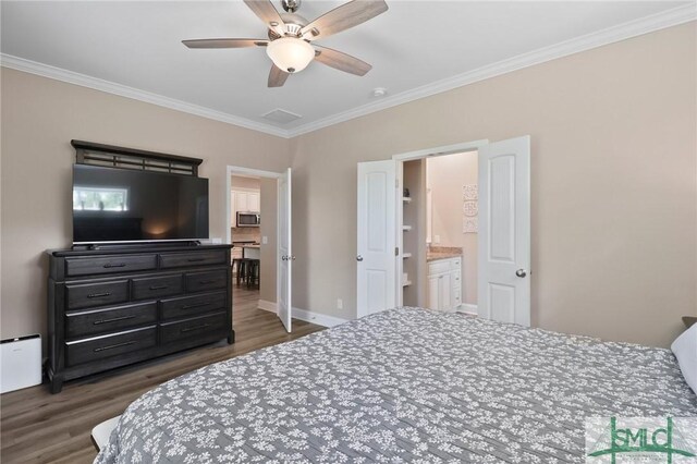 620 W 9th St, Rincon, GA 31326 - bedroom with ceiling fan, baseboards, crown molding, and wood finished floors