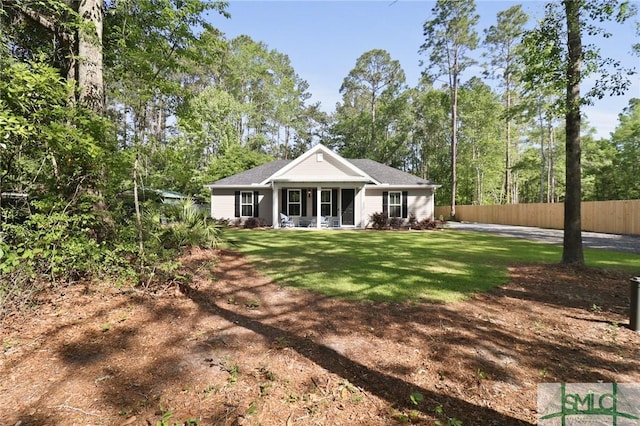 620 W 9th St, Rincon, GA 31326 - rear view of house with a lawn and fence