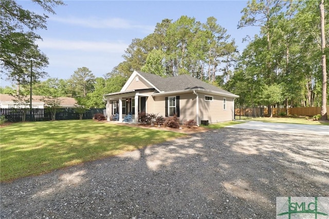 620 W 9th St, Rincon, GA 31326 - view of front of property featuring driveway, a front yard, and fence