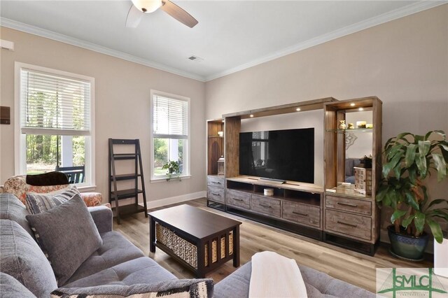 620 W 9th St, Rincon, GA 31326 - living room with light wood finished floors, visible vents, crown molding, baseboards, and ceiling fan