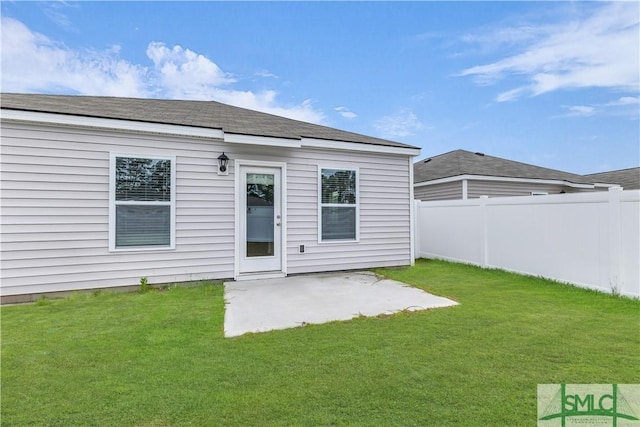 19 Arrowhead Way, Port Wentworth, GA 31407 - back of property with fence, a patio area, and a lawn
