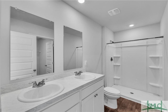 19 Arrowhead Way, Port Wentworth, GA 31407 - bathroom featuring a shower, wood finished floors, toilet, and a sink