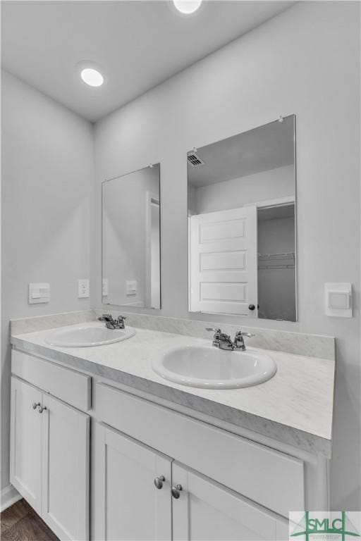 19 Arrowhead Way, Port Wentworth, GA 31407 - bathroom with double vanity, visible vents, and a sink