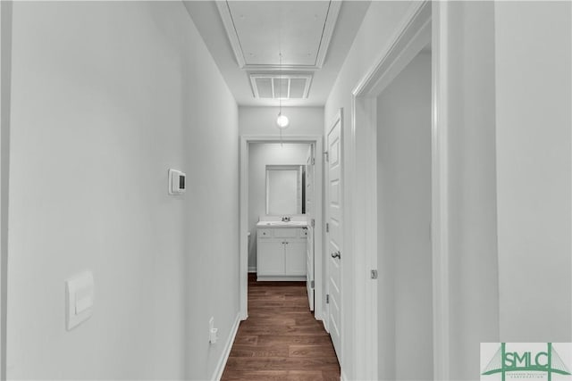 19 Arrowhead Way, Port Wentworth, GA 31407 - corridor featuring attic access, visible vents, dark wood finished floors, and baseboards