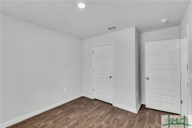19 Arrowhead Way, Port Wentworth, GA 31407 - unfurnished bedroom with visible vents, baseboards, and dark wood finished floors