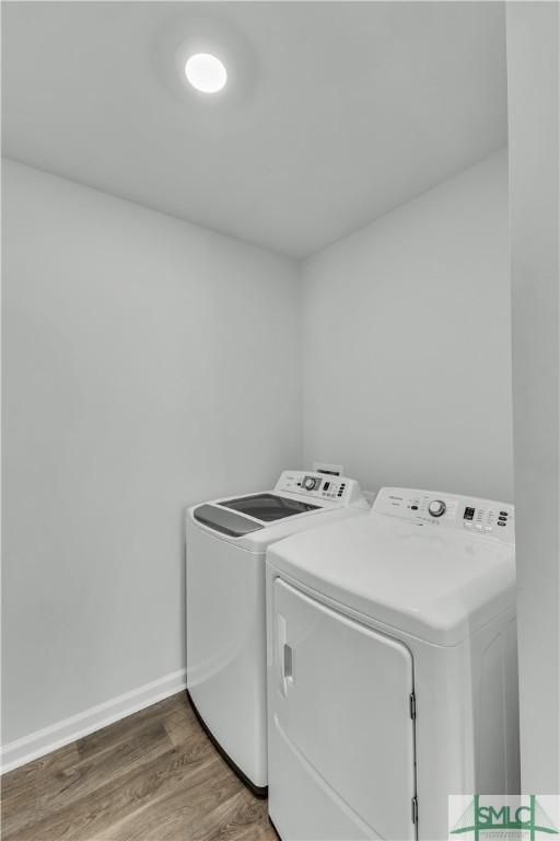 19 Arrowhead Way, Port Wentworth, GA 31407 - laundry room with washer and dryer, wood finished floors, laundry area, and baseboards