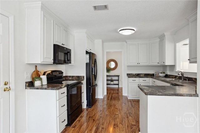 116 Rose Dhu Way, Savannah, GA 31419 - kitchen with black appliances, white cabinets, wood finished floors, and a peninsula