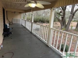 exterior space featuring ceiling fan
