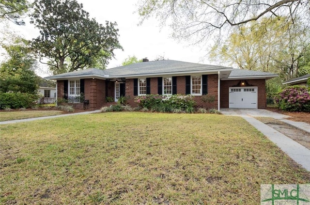 single story home featuring a chimney, brick siding, a garage, driveway, and a front lawn