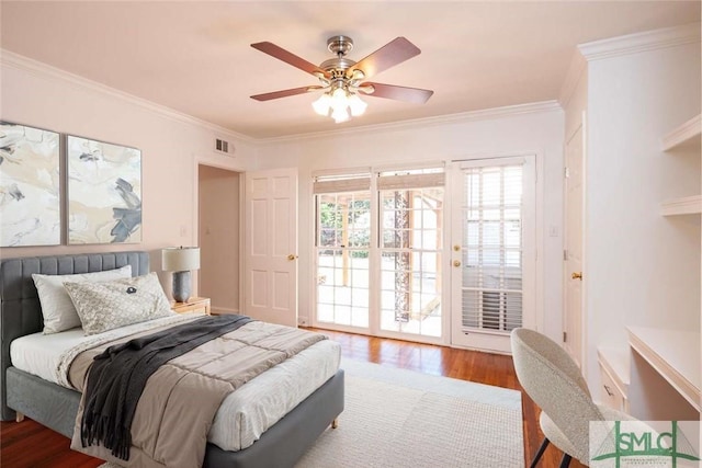 bedroom with visible vents, wood finished floors, access to outside, and crown molding