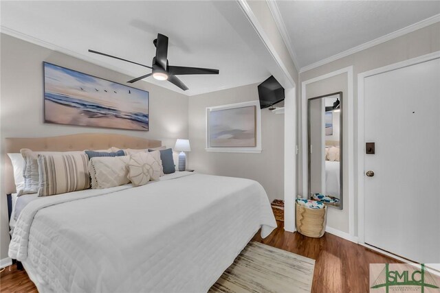 1217 Bay St Unit 230A, Tybee Island, GA 31328 - bedroom with baseboards, wood finished floors, a ceiling fan, and crown molding