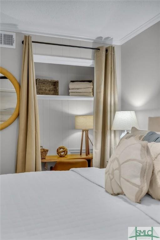 1217 Bay St Unit 230A, Tybee Island, GA 31328 - bedroom with visible vents and ornamental molding