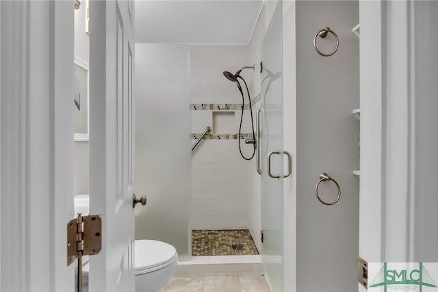 1217 Bay St Unit 230A, Tybee Island, GA 31328 - bathroom with toilet and a shower stall