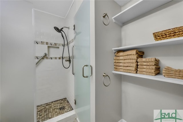 1217 Bay St Unit 230A, Tybee Island, GA 31328 - bathroom featuring crown molding and a stall shower