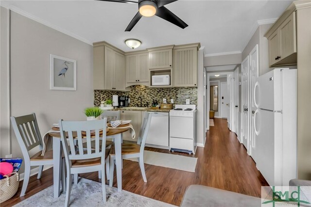 1217 Bay St Unit 230A, Tybee Island, GA 31328 - kitchen with tasteful backsplash, ceiling fan, light countertops, cream cabinets, and white appliances
