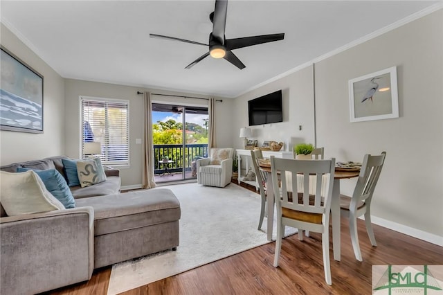 1217 Bay St Unit 230A, Tybee Island, GA 31328 - living area featuring baseboards, wood finished floors, ceiling fan, and ornamental molding