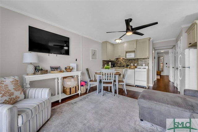1217 Bay St Unit 230A, Tybee Island, GA 31328 - living room with a ceiling fan, dark wood-style flooring, and crown molding