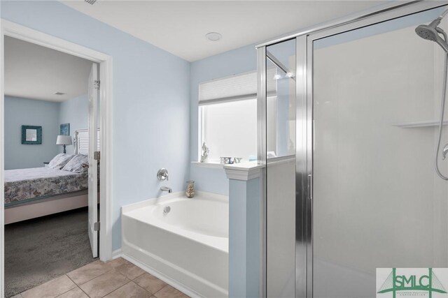 378 Southwilde Way, Pooler, GA 31322 - bathroom featuring a bath, a stall shower, tile patterned floors, baseboards, and ensuite bath