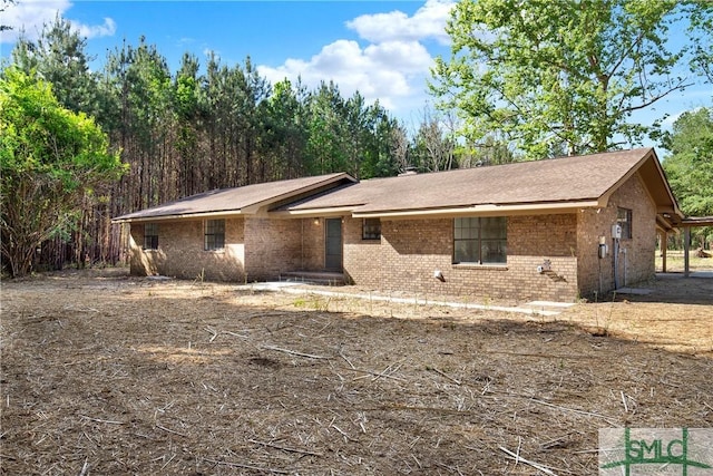 view of front of house featuring brick siding