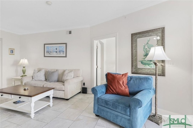 1609 Strand Ave Unit 206, Tybee Island, GA 31328 - living room featuring ornamental molding, baseboards, and light tile patterned flooring