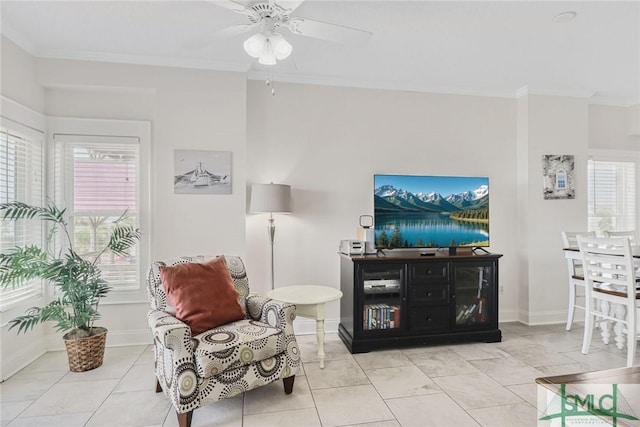 1609 Strand Ave Unit 206, Tybee Island, GA 31328 - living area featuring crown molding, ceiling fan, baseboards, and light tile patterned floors