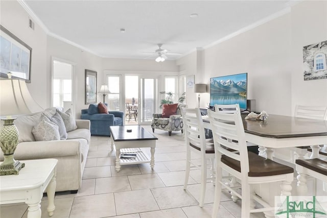 1609 Strand Ave Unit 206, Tybee Island, GA 31328 - tiled living area with a ceiling fan and crown molding