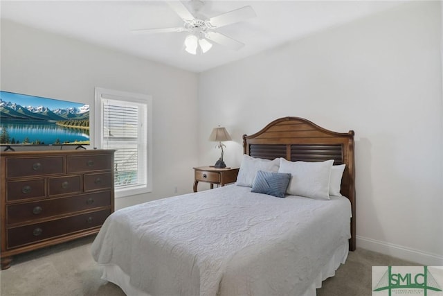 1609 Strand Ave Unit 206, Tybee Island, GA 31328 - bedroom featuring light carpet, baseboards, and a ceiling fan