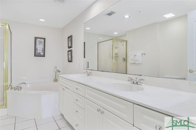1609 Strand Ave Unit 206, Tybee Island, GA 31328 - full bath with a shower stall, a bath, double vanity, tile patterned floors, and recessed lighting