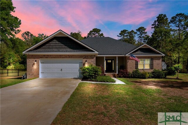 107 Mingledorff Way, Springfield, GA 31329 - view of front of property with a lawn, driveway, fence, and brick siding
