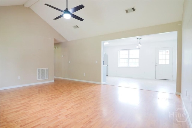 309 Wilkinson Rd NE, Ludowici, GA 31316 - unfurnished room with a ceiling fan, light wood-type flooring, beamed ceiling, high vaulted ceiling, and baseboards