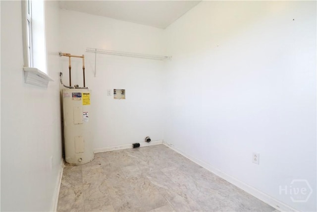309 Wilkinson Rd NE, Ludowici, GA 31316 - laundry room with water heater, washer hookup, baseboards, and electric dryer hookup