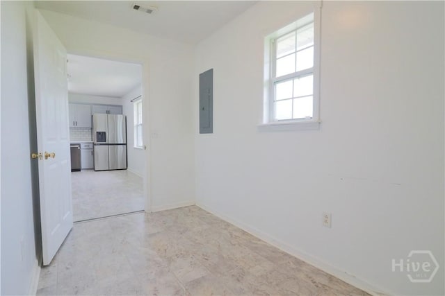 309 Wilkinson Rd NE, Ludowici, GA 31316 - unfurnished room with healthy amount of natural light, electric panel, and baseboards
