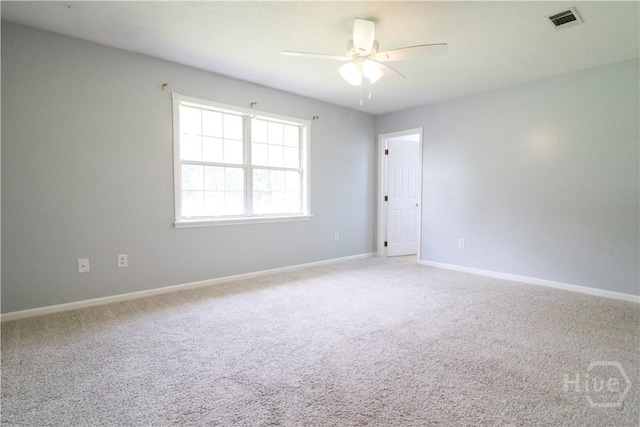 309 Wilkinson Rd NE, Ludowici, GA 31316 - empty room featuring carpet flooring, ceiling fan, and baseboards