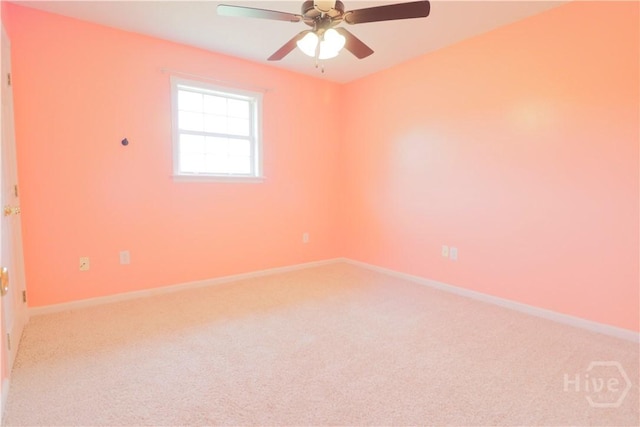 309 Wilkinson Rd NE, Ludowici, GA 31316 - spare room with light colored carpet, a ceiling fan, and baseboards