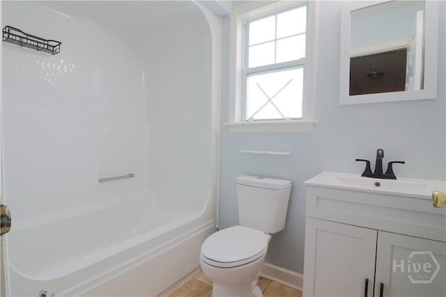 309 Wilkinson Rd NE, Ludowici, GA 31316 - full bathroom featuring vanity, toilet, washtub / shower combination, and baseboards