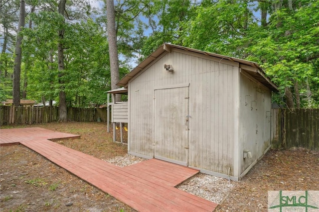 view of shed with a fenced backyard