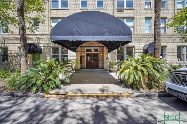 106 W Gwinnett St Unit G3, Savannah, GA 31401 - view of exterior entry with french doors and brick siding