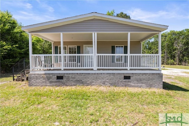 1173 Ga Highway 21 N, Springfield, GA 31329 - view of front of house with a porch, crawl space, and a front lawn