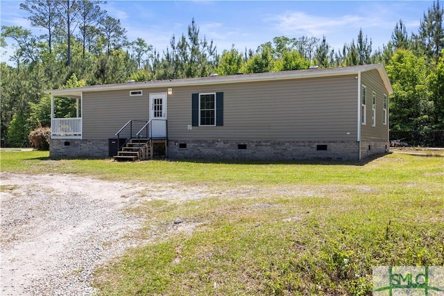 1173 Ga Highway 21 N, Springfield, GA 31329 - view of front facade with a front yard and crawl space