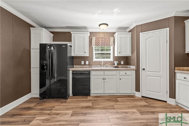 1173 Ga Highway 21 N, Springfield, GA 31329 - kitchen with light countertops, white cabinets, black appliances, light wood finished floors, and a sink