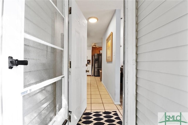 hall with light tile patterned flooring
