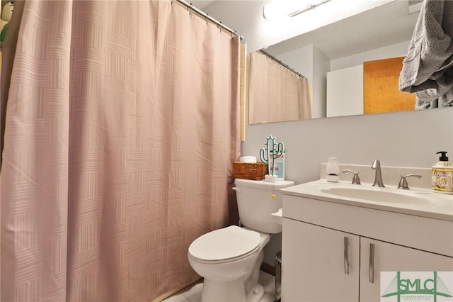 full bathroom featuring toilet, tile patterned flooring, and vanity