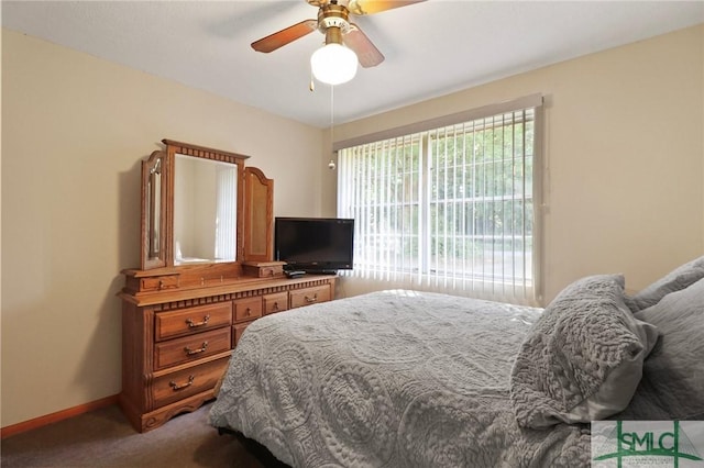 carpeted bedroom featuring a ceiling fan and baseboards