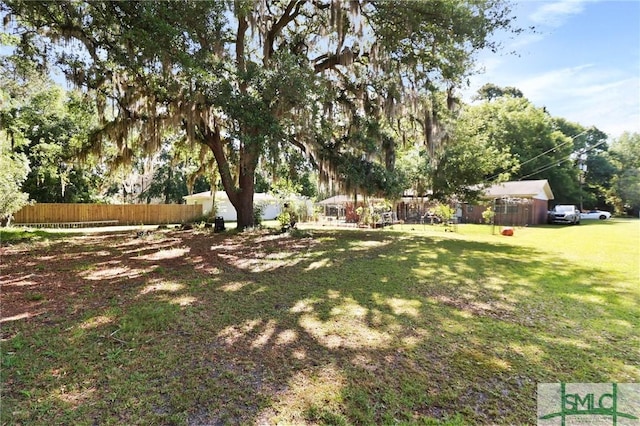 view of yard featuring fence