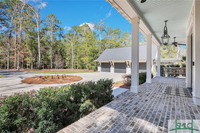 31 Tivoli Ln, Richmond Hill, GA 31324 - view of patio / terrace featuring concrete driveway
