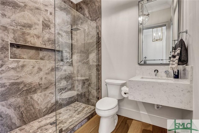 31 Tivoli Ln, Richmond Hill, GA 31324 - full bath with toilet, a walk in shower, ornamental molding, and wood finished floors