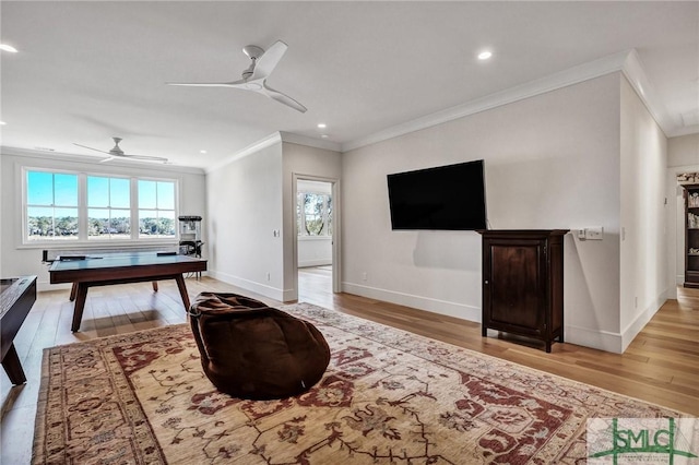 31 Tivoli Ln, Richmond Hill, GA 31324 - living area with light wood-style flooring, ceiling fan, and ornamental molding